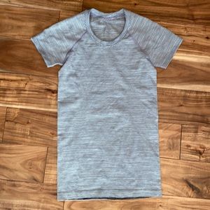 Swiftly tech short sleeve lulu lemon top grey and black mixed stripe, size 4